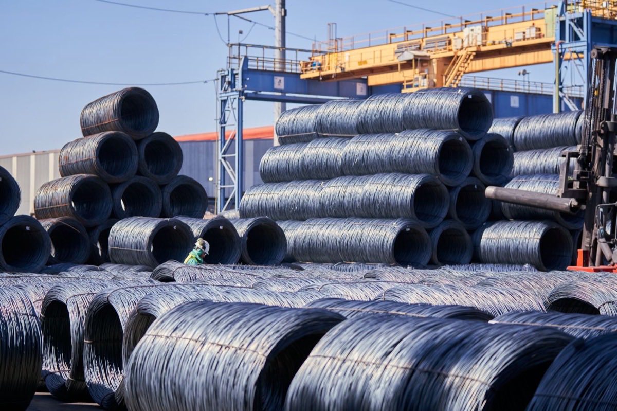Steel wire coils stacked at an industrial yard
